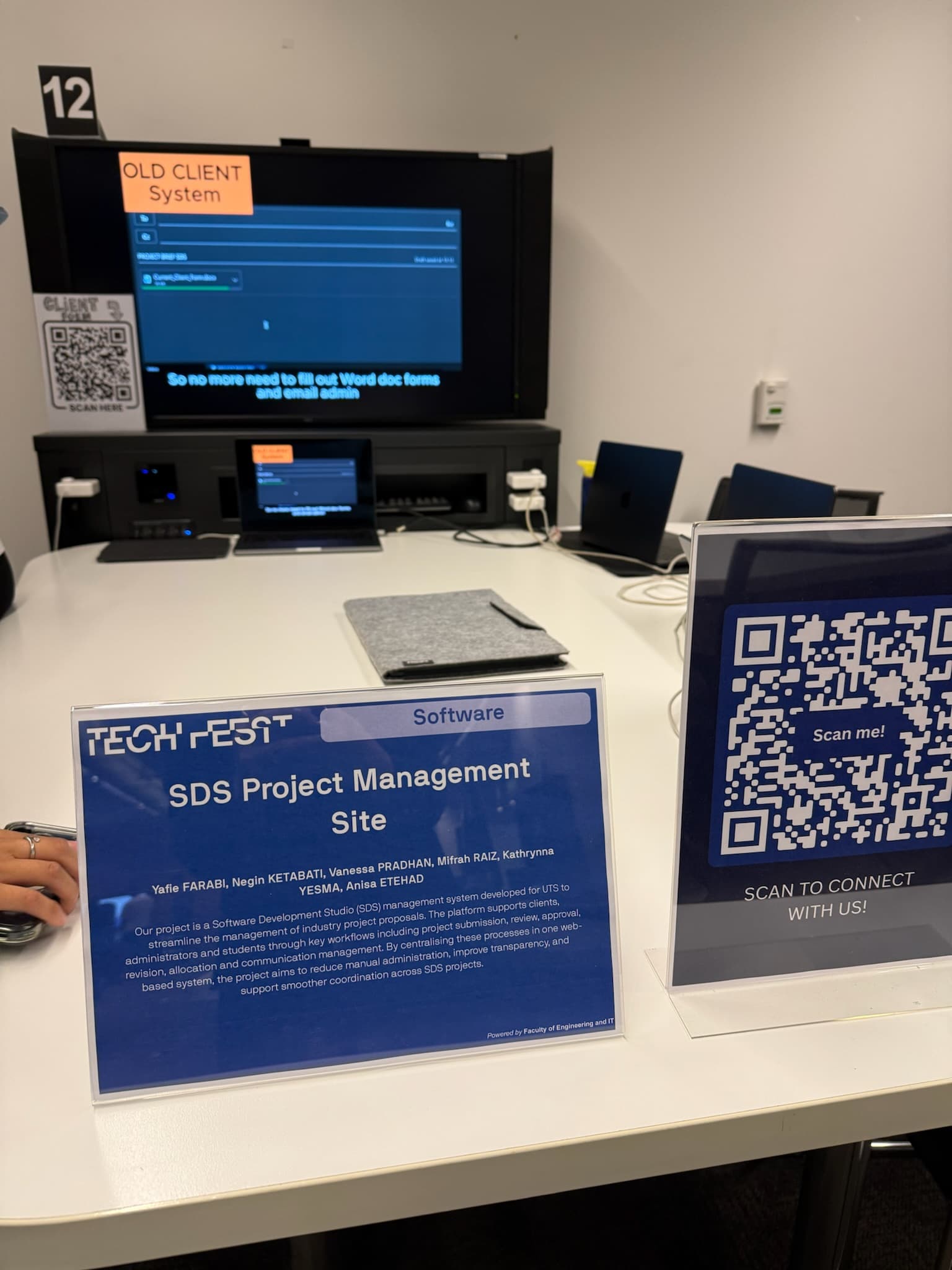 Overview of the SDS Project Management Site Tech Fest booth with QR code and demo screens